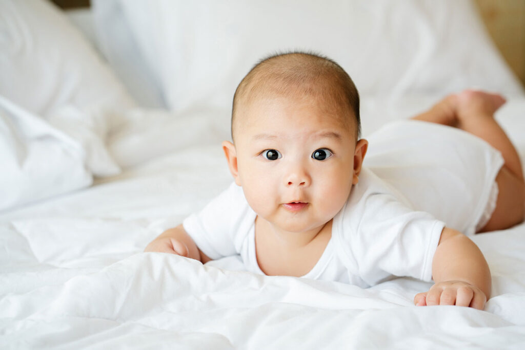 An asian baby tummy time